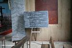 Lessons on a chalkboard in a church in Gabon