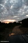 Sunrise over the roof of a safari vehicle