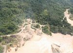 Miners' shantytown next to Rio Huaypetue gold mine [aerial-rainforest-Flight_1022_1583]