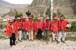 Willoq men in Ollantaytambo wearing traditional red clothing