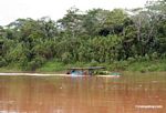 River boat carrying goods to market on the Rio Tambopata