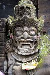 Statue at Puri Saren Agung palace; with offering (Ubud, Bali) 