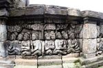 Wall carvings at Borobudur; people under tree (Java)
