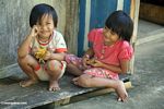 Little girls on a porch in Lemo (Toraja Land (Torajaland), Sulawesi) 