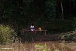 Father and child fishing in a rice paddy (Toraja Land (Torajaland), Sulawesi) 