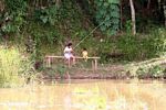 Kids fishing in a rice paddy (Toraja Land (Torajaland), Sulawesi) 