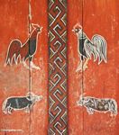 Painting of roosters and water buffalos--orange, red, and dark brown paint (Toraja Land (Torajaland), Sulawesi) 