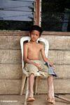 Boy on porch in Tikala (Toraja Land (Torajaland), Sulawesi) 