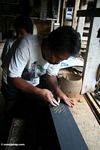 Man carving wood souvenirs at Ketu Kese (Toraja Land (Torajaland), Sulawesi) 