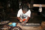 Painting carved wooded boxes at Keta Kese (Toraja Land (Torajaland), Sulawesi) 