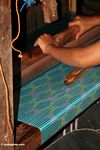 Woman weaving a turquoise silk piece-detail (Sulawesi (Celebes))
